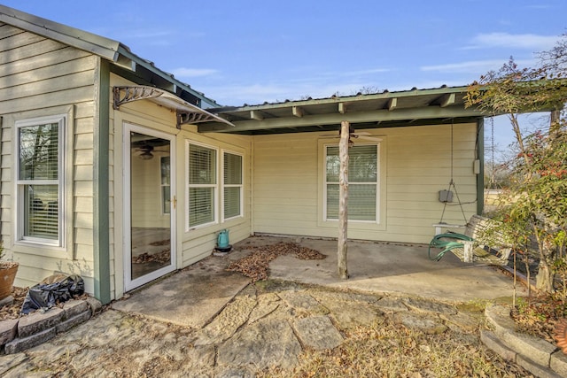 exterior space featuring ceiling fan and a patio area