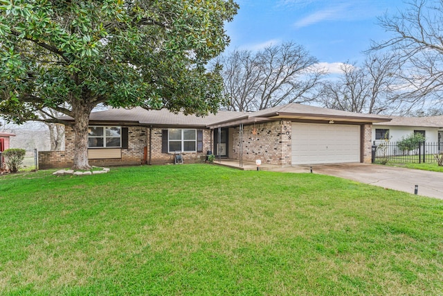 ranch-style home featuring a garage and a front yard