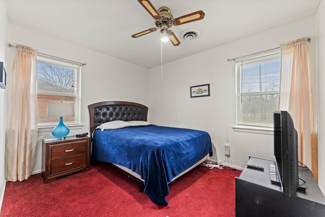 bedroom with dark carpet and ceiling fan