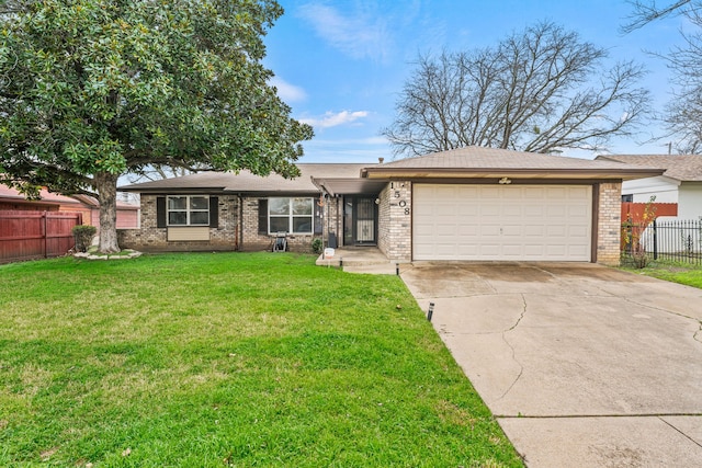 ranch-style house featuring a garage and a front yard