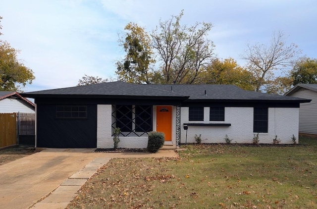 ranch-style home featuring a front yard