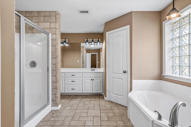 bathroom with vanity and plus walk in shower