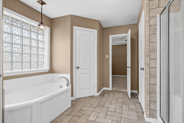 bathroom with separate shower and tub