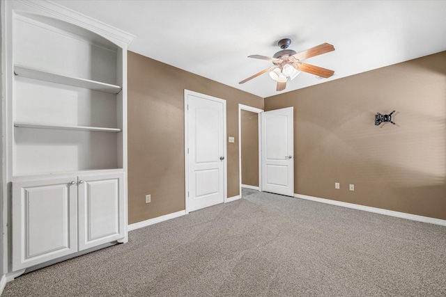 unfurnished bedroom featuring ceiling fan and carpet floors