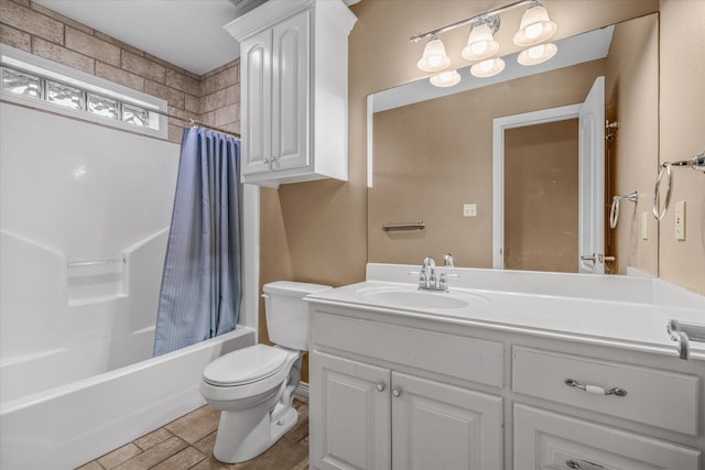 full bathroom featuring vanity, shower / tub combo, and toilet