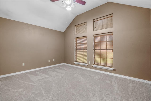 unfurnished room featuring lofted ceiling, light carpet, and ceiling fan