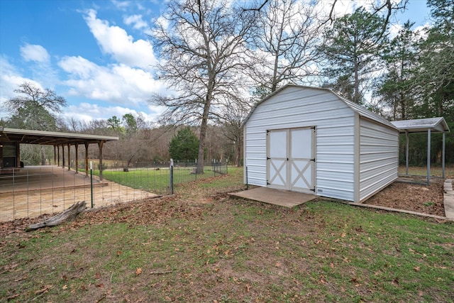 view of yard featuring a carport and a storage shed