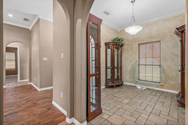 hallway with crown molding and wood-type flooring