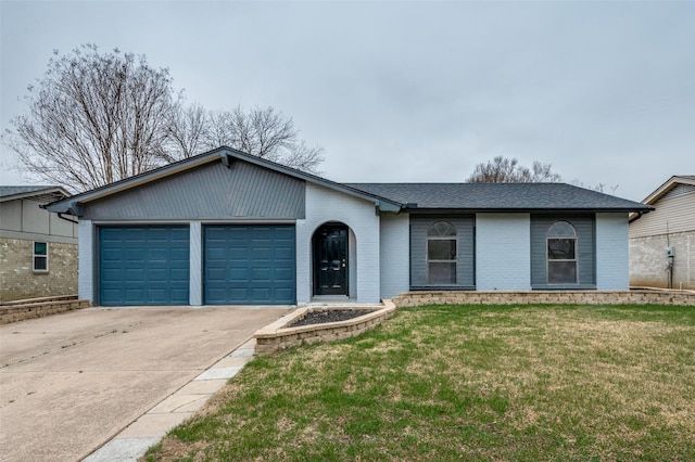 single story home featuring a garage and a front yard