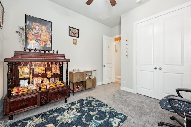 office area with carpet floors and ceiling fan