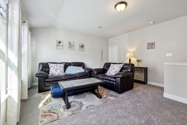 carpeted living room featuring lofted ceiling