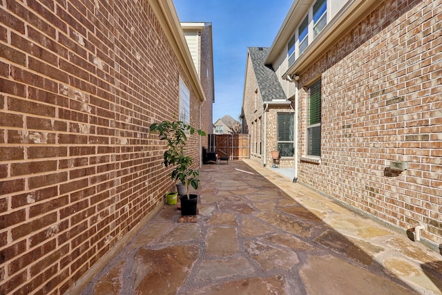 view of side of home featuring a patio area