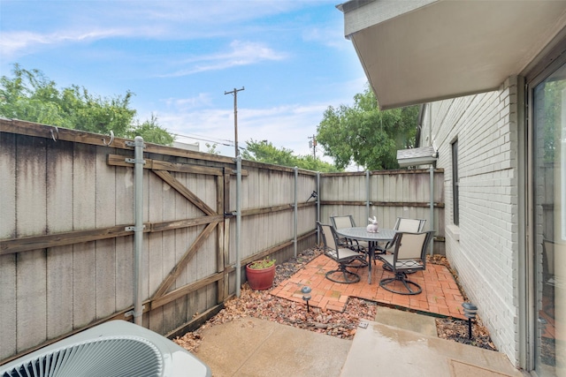 view of patio / terrace featuring cooling unit