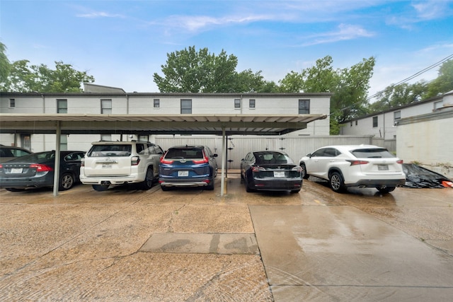 view of parking / parking lot with a carport