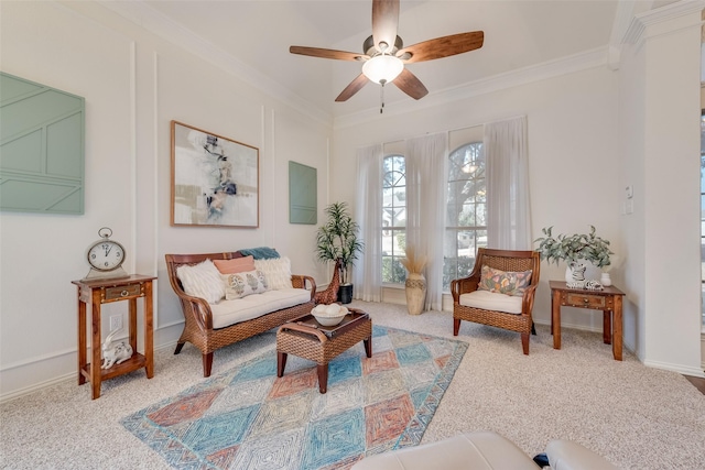 sitting room featuring light carpet, crown molding, and ceiling fan