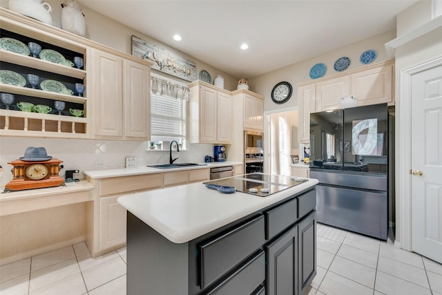 kitchen featuring sink, a center island, light tile patterned floors, appliances with stainless steel finishes, and gray cabinets