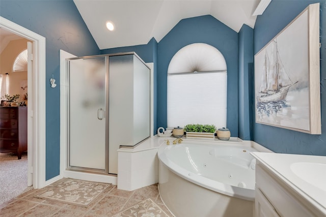 bathroom with lofted ceiling, separate shower and tub, and vanity