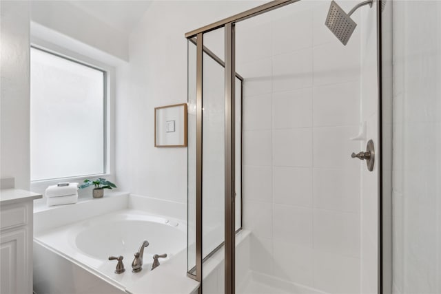 bathroom with vanity and separate shower and tub