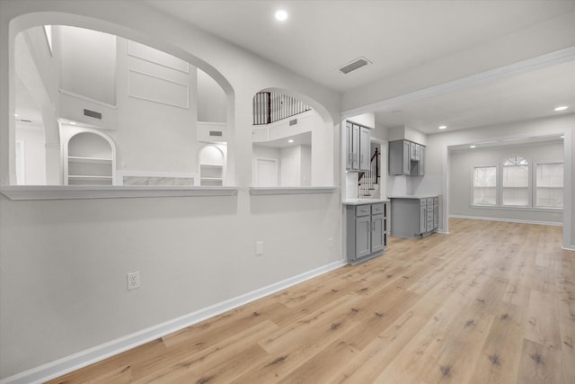 unfurnished living room with light wood-type flooring