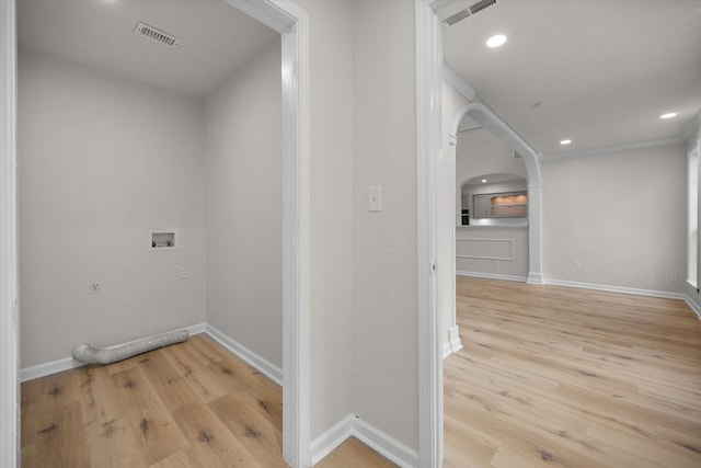 washroom with washer hookup, electric dryer hookup, and light wood-type flooring