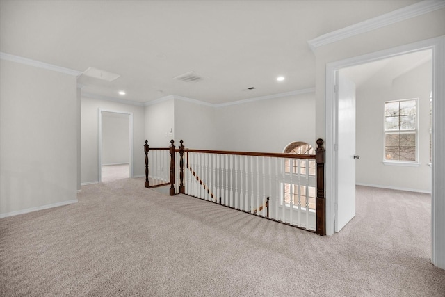 hall featuring crown molding and light colored carpet