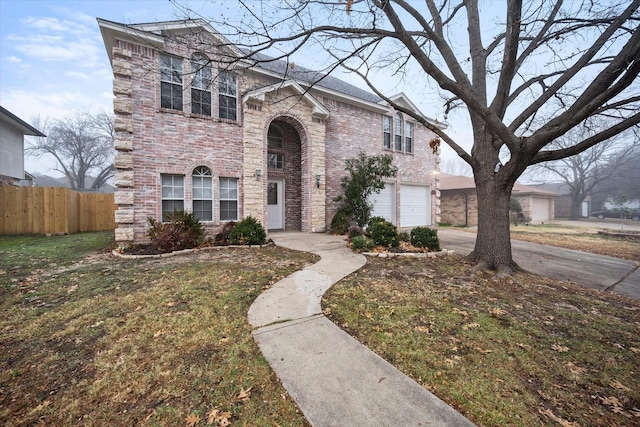 view of front facade featuring a garage and a front yard