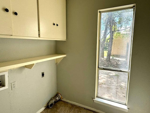 laundry room with cabinets, washer hookup, light tile patterned floors, and electric dryer hookup