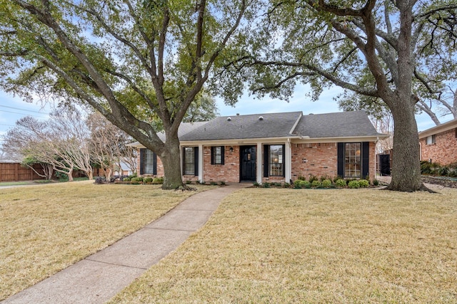 ranch-style house featuring a front lawn