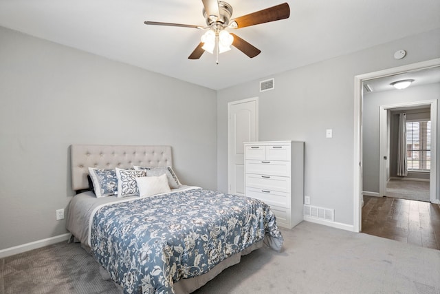 carpeted bedroom with ceiling fan