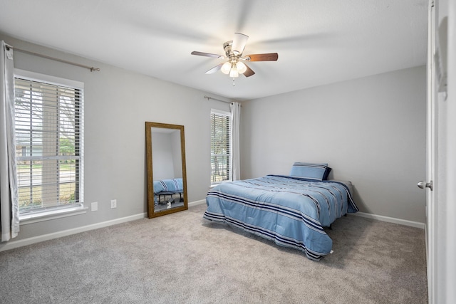 bedroom featuring light colored carpet and ceiling fan