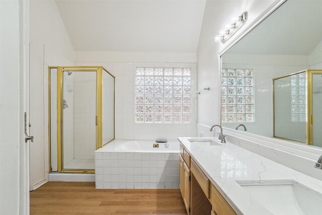 2324 Spring Mills Rd, Mesquite, TX 75181 - full bath with double vanity, vaulted ceiling, a sink, and a stall shower