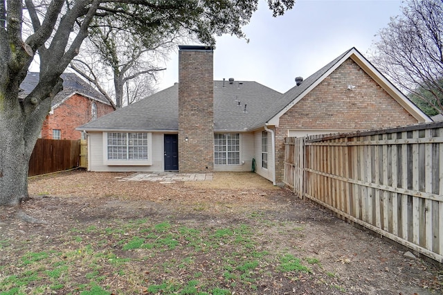 rear view of property featuring a patio