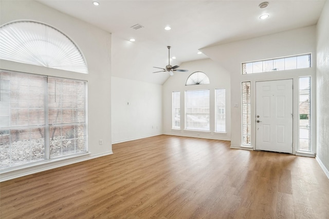 entryway featuring ceiling fan, hardwood / wood-style floors, and high vaulted ceiling