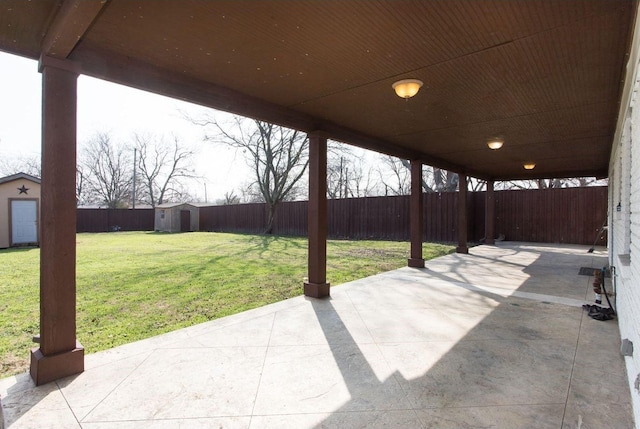 view of patio with a storage shed