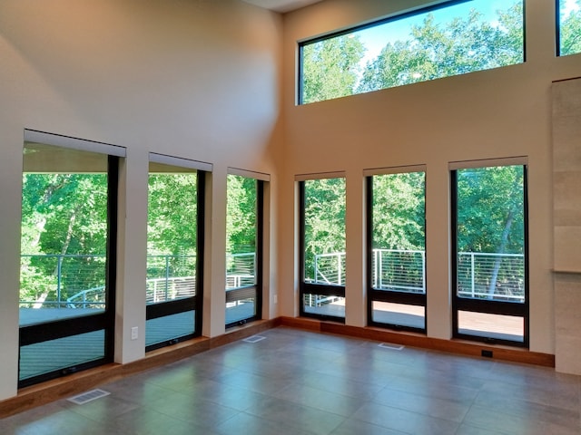 1621 Caddys Cir, Garland, TX 75043 - doorway to outside with tile patterned floors and a high ceiling