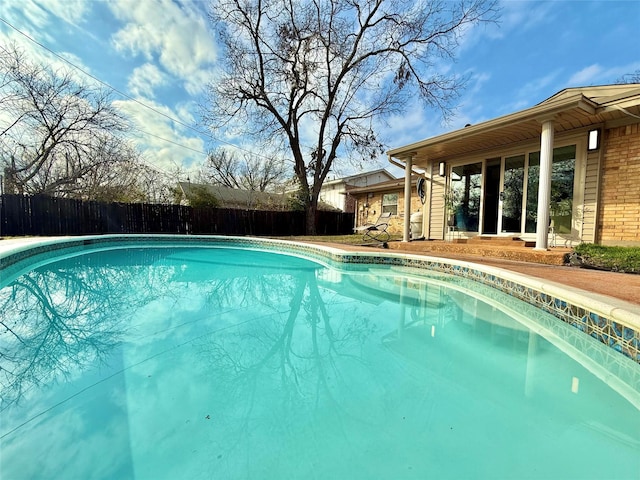 view of pool featuring fence and a fenced in pool