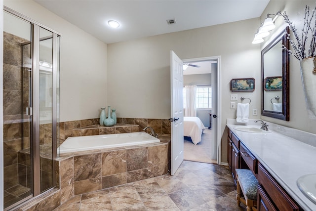 bathroom featuring vanity and separate shower and tub