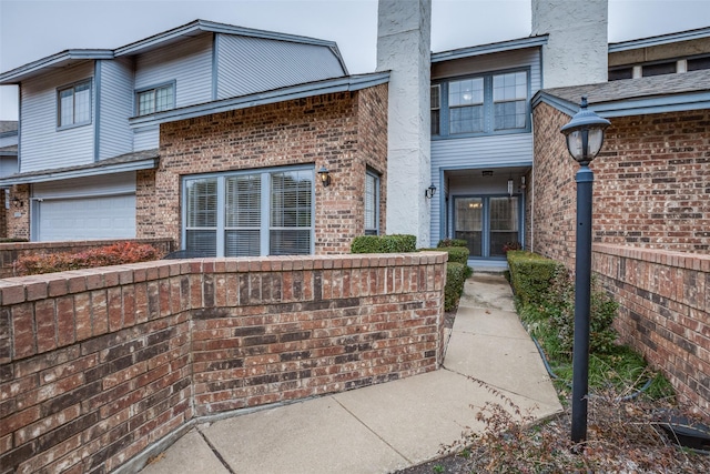 property entrance featuring a garage