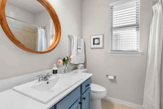 bathroom featuring a shower with curtain, vanity, tile patterned floors, and toilet