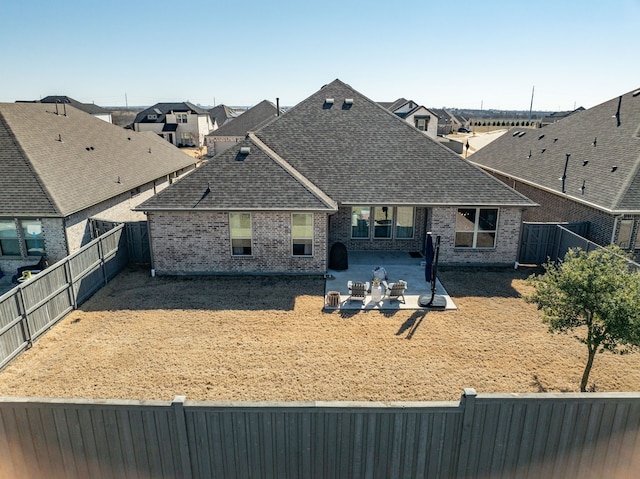 rear view of property with a patio