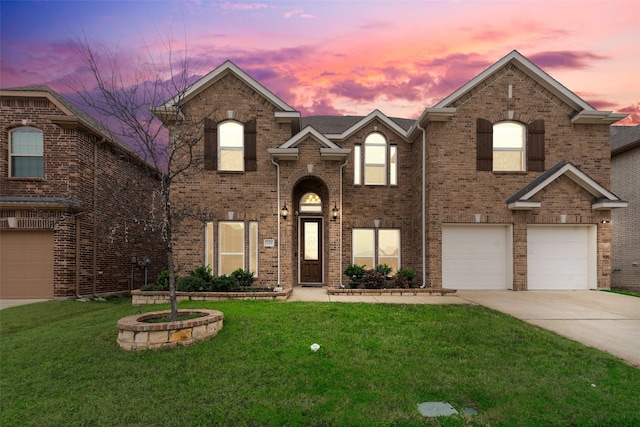 view of front of property with a garage and a lawn