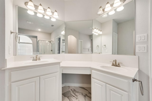 bathroom with an enclosed shower and vanity