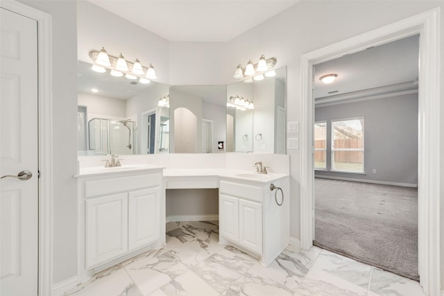 200 Ravenel St, Glenn Heights, TX 75154 - bathroom with marble look tiles, double vanity, baseboards, and a shower stall