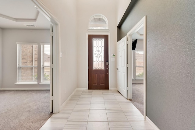 view of carpeted entrance foyer