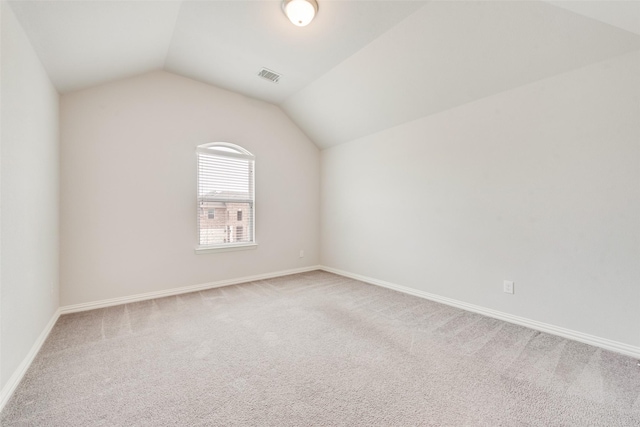 200 Ravenel St, Glenn Heights, TX 75154 - empty room featuring carpet flooring, vaulted ceiling, and baseboards