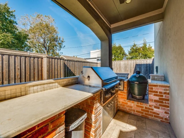 view of patio / terrace featuring grilling area and exterior kitchen