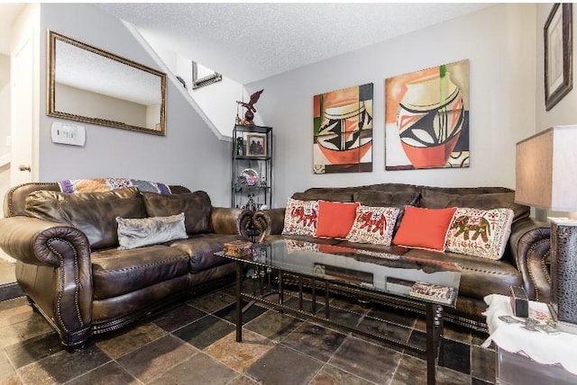 living room featuring a textured ceiling