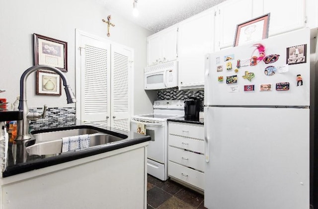 kitchen featuring tasteful backsplash, white appliances, sink, and white cabinets