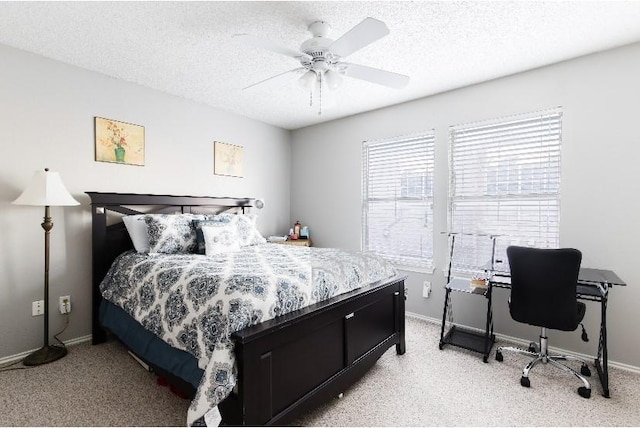 bedroom featuring ceiling fan and a textured ceiling