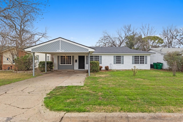 single story home featuring a carport and a front yard